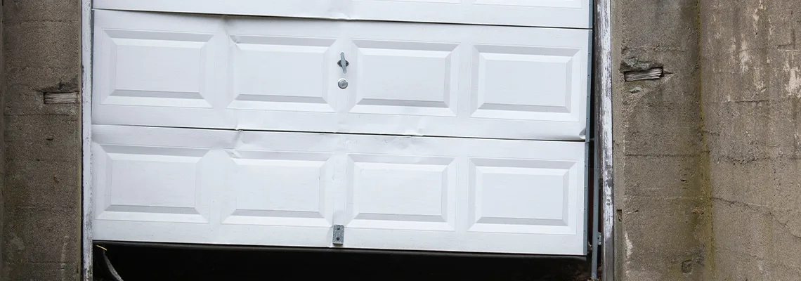 Garage Door Got Hit By A Car Dent Removal in London, ON
