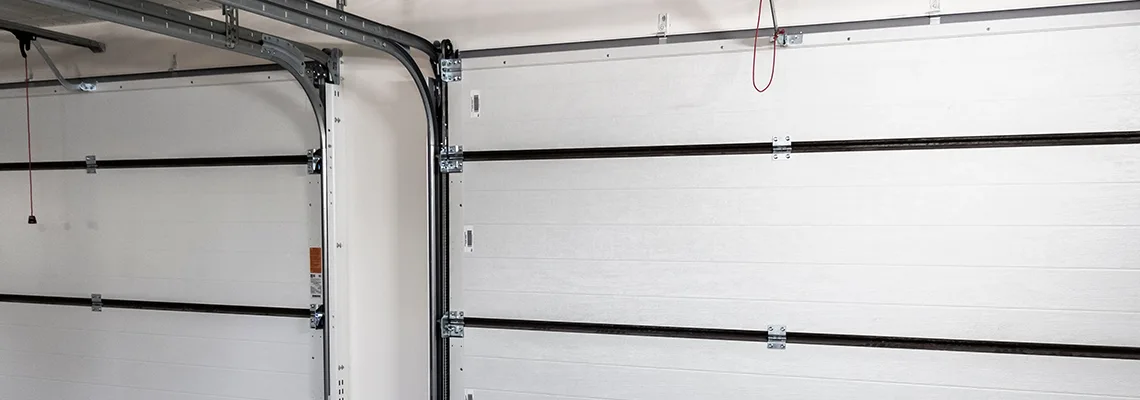 Fix Folding Garage Door Jerking in London, Ontario